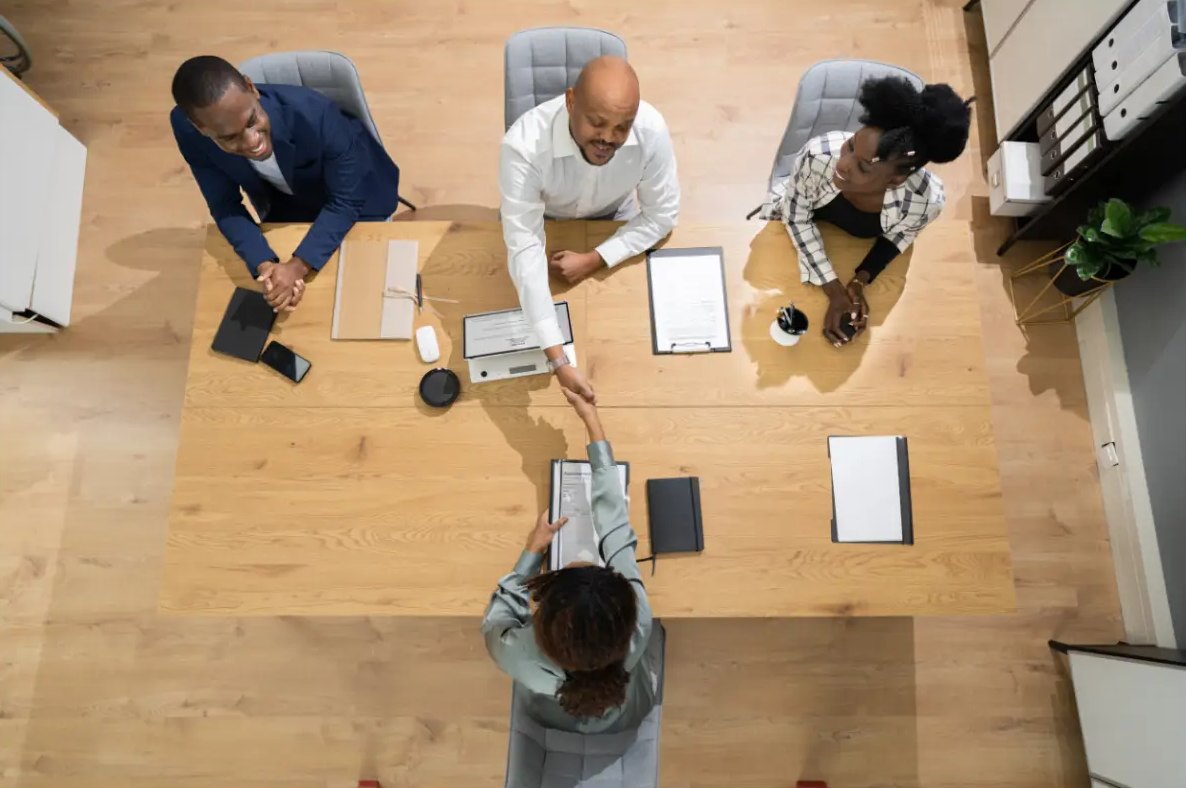 Recruiting team meeting with a candidate around a conference table