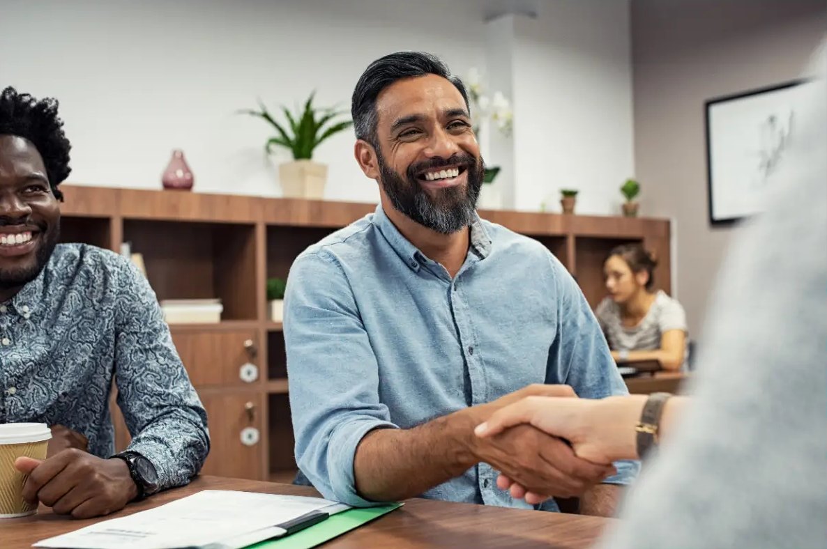 Hiring manager shaking hands with a new placement