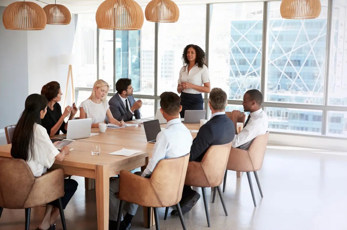 Leadership team meeting in a bright boardroom